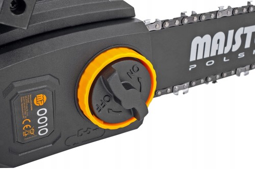 Mechanizm naciągu łańcucha, obsługiwany za pomocą dużego, pomarańczowego pokrętła z czarnym środkiem.