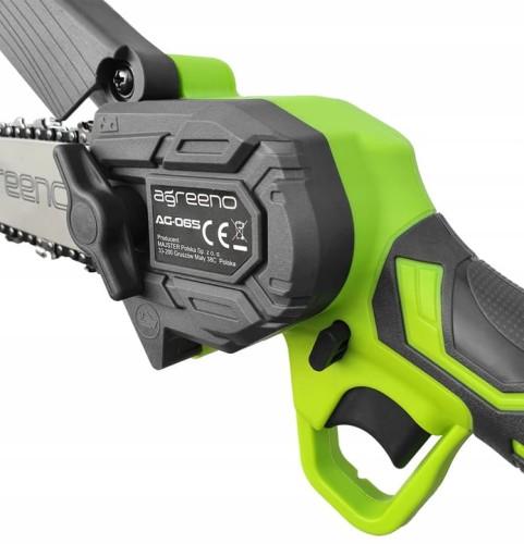 Ergonomiczny uchwyt, z elementami antypoślizgowymi w kolorze zielonym.